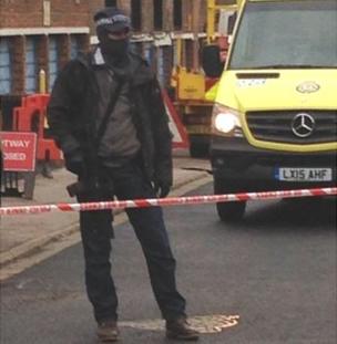 A police officer in a balaclava