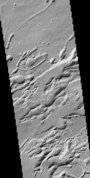 A structure called Arsia Chasmata on the flanks of one of the large volcanoes, Arsia Mons. The width of the image is around 25 km