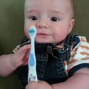 Baby with a toothbrush