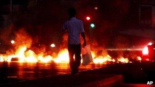 Burning tyres in Jidhafs, Bahrain, on the outskirts of the capital of Manama - 16 August 2010