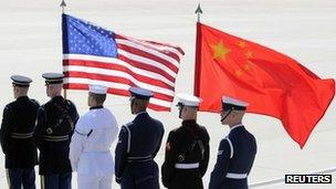 A colour guard of US. and Chinese flags awaits the plane of China's President Hu Jintao at Andrews Air Force Base, Maryland (file photo)