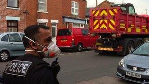 A policeman wearing a face mask