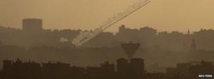 A rocket is seen as it is fired from the northern Gaza Strip towards Israel, 25 July 2014