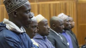 Sady Abdou, Hemedi Dendengo Sefu, Amani Uriwane, Richard Bachisa, Hassann Nduli and Pascal Kanyandekwe, six men accused of the attempted assassination of General Nyamwasa, former Rwanda chief of staff, listen on 28 August 2014 on the first day of their sentencing at the Kagiso Magistrate Court in Krugersdorp, South Africa