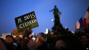 A demonstrator holds a sign reading "I am Charlie" at Place de la Nation during a rally in Paris, 11 January 2015