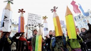 People hold boards shaped as pens during a Unity Rally "Marche Republicaine" in Reims, 11 January 2015