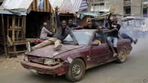 Nigerians celebrate the anticipated victory of presidential candidate Muhammadu Buhari in Kaduna, Nigeria Tuesday, 31 March 2015.