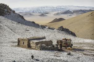 Herder Shohan's winter home - the family's possessions loaded on to a truck - copyright Timothy Allen