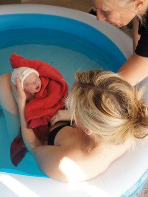 midwife and new baby