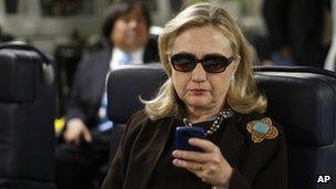 Ms Clinton using a mobile phone