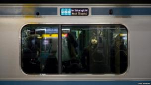 Woman on a train in Japan