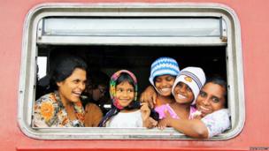 Sri Lankan family in train window