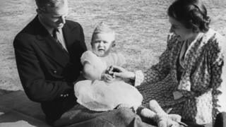 A baby Prince Charles with his parents in the grounds of Windlesham Moor in Surrey