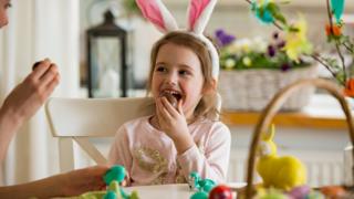 Girl eating Easter chocolate