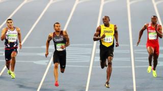 Adam Gemili of Great Britain, Andre De Grasse of Canada, Usain Bolt of Jamaica and Salem Eid Yaqoob of Bahrain compete in the men's 200m semi-final
