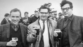 Architects John Cowell, Andy MacMillan and Isi Metzstein celebrate at the "topping out" ceremony in 1965