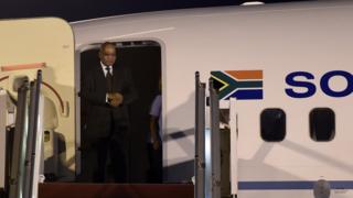 South-African President Jacob Zuma arrives at the Houari-Boumediene international airport in Algiers on March 30, 2015. Zuma arrived in Algeria for a three-day official visit at the invite of Algerian President Abdelaziz Bouteflika.