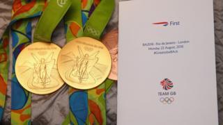Medals lay out next to a British Airways leaflet