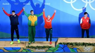 Phelps, Chad le Clos, Laszlo Cseh and Joseph Schooling on the podium
