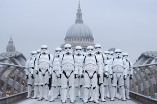 People dressed as stormtroopers from the Star Wars franchise of films pose on the Millennium Bridge in London to promote the latest release in the series. 15 December 2016