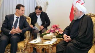 Hassan Rouhani met his Syrian counterpart Bashar al-Assad on Monday - without Mr Zarif.  ©AFP