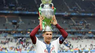 ronaldo holding european championship trophy