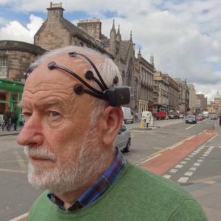 A man wearing an EEG