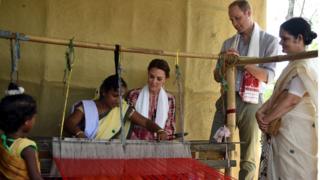 The Royal couple watch an Indian woman make hand woven cloth
