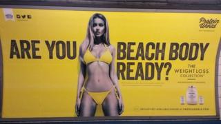 Protein World's advert, asking Are you beach body ready?