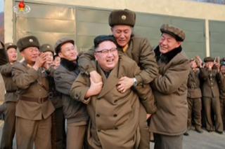 Picture of Kim Jong-un piggybacking a military officer in a photo released on 19 March 2017