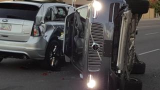 A self-driven Volvo SUV owned and operated by Uber Technologies Inc. is flipped on its side after a collision in Tempe, Arizona, U.S. on March 24, 2017.