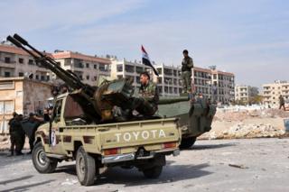 Syrian government troops in the recaptured village of al-Minian, Aleppo, 12 November