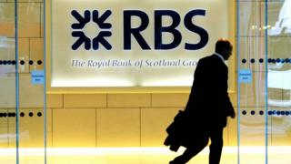 A man walks into the London headquarters of the Royal Bank of Scotland