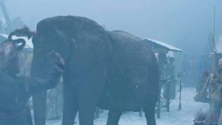 Elephant walking across the Thames.