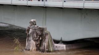 The Zouave statue submerged in rising water