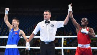 Chinese boxer, Bin LV, celebrates