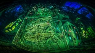 Motorbikes in a ship wreck.