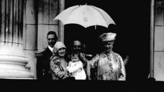Queen Elizabeth II as a baby on the balcony of Buckingham Palace for the Trooping the Colour parade