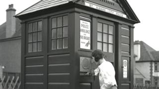 Woman at a police box around 1935