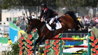Nick Skelton rides Big Star during the individual jumping third qualifier