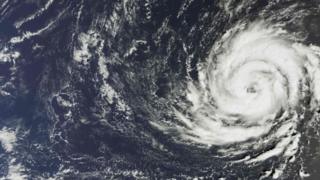 A handout satellite image captured by the The Copernicus Sentinel-3A satellites OLCI instrument on October 11, 2017 and released by the European Space Agency (ESA) on Octob er 15, 2017 shows Hurricane Ophelia over the Atlantic Ocean
