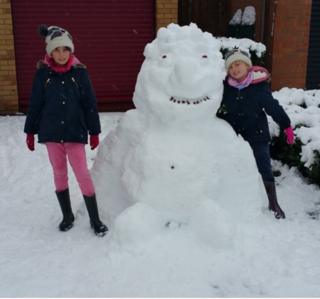 Girls and a snow gorilla
