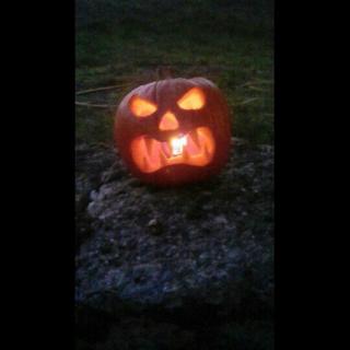 Pumpkin with a candle in