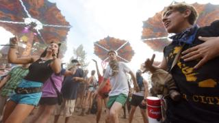 Festival goers dance at the Oregon Eclipse Festival, August 20, 2017, at Big Summit Prairie ranch in Oregon's Ochoco National Forest near the city of Mitchell ahead of the total solar eclipse on August 21, 2017.
