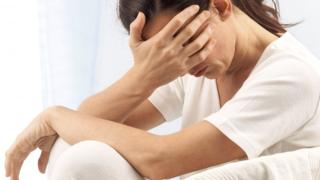 woman looking unhappy