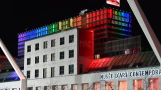 Montreal's museum of modern art is seen on April 11, 2020, illuminated in the colours of the rainbow as a sign of hope and in support of victims of the coronavirus.