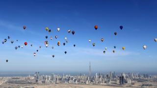 Hot air balloons fly over Dubai during the World Air Games 2015