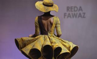 A model presents a creation by label Reda Fawaz during a fashion show marking the 170th anniversary of Dutch manufacturer Vlisco in Abidjan, Ivory Coast - Saturday 26 November 2016