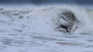 Surfer riding a large wave