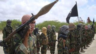 Al-Shabab fighters display weapons as they conduct military exercises in northern Mogadishu, Somalia
